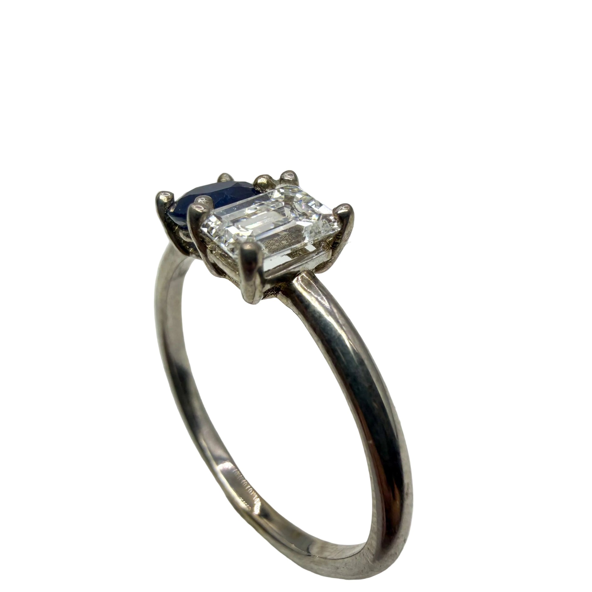 14kt white gold emerald cut diamond and round blue sapphire ring