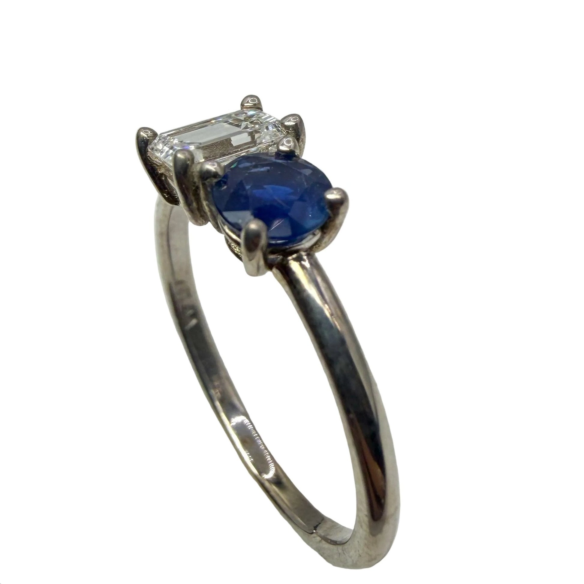 14kt white gold emerald cut diamond and round blue sapphire ring