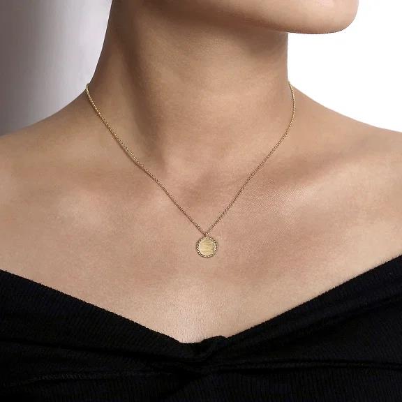 14K Yellow Gold Round Pendant Necklace with Bujukan Bead Frame being worn